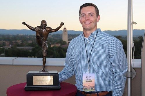 Dan Boshart poses with the Campbell Trophy while attending the Campbell Trophy Summit recently at Stanford (photo provided by the National Football Foundation)