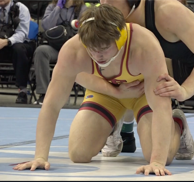 Fairbury wrestler Seth Firmanik duals with No. 1 ranked Eli Jansen of Omaha Skutt Catholic.