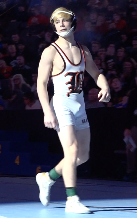 Beatrice sophomore Trevor Reinke walks out onto the floor before his championship bout in Class B 132.