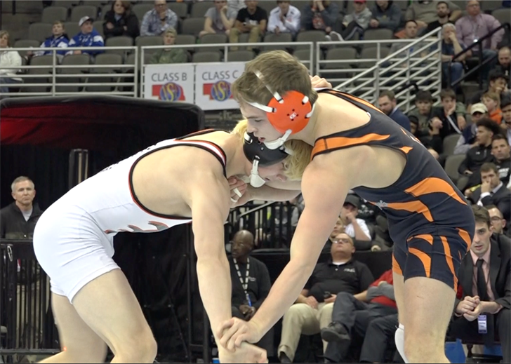 Beatrice wrestler Trevor Reinke gets locked up with Bryce Brown of Hastings.