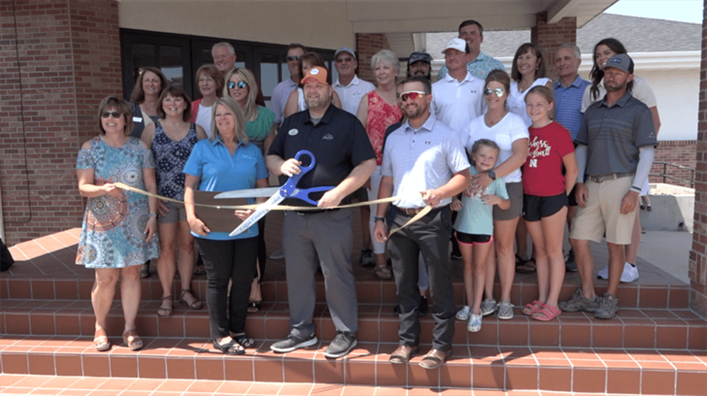 Representatives from Sky Ranch Golf Course and the Logan County Chamber of Commerce pose before the ribbon cutting at the golf course. Photo by Elic Chisam