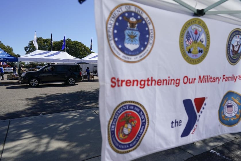 A man receives food at an Armed Services YMCA food distribution, Oct. 28, 2021, in San Diego.