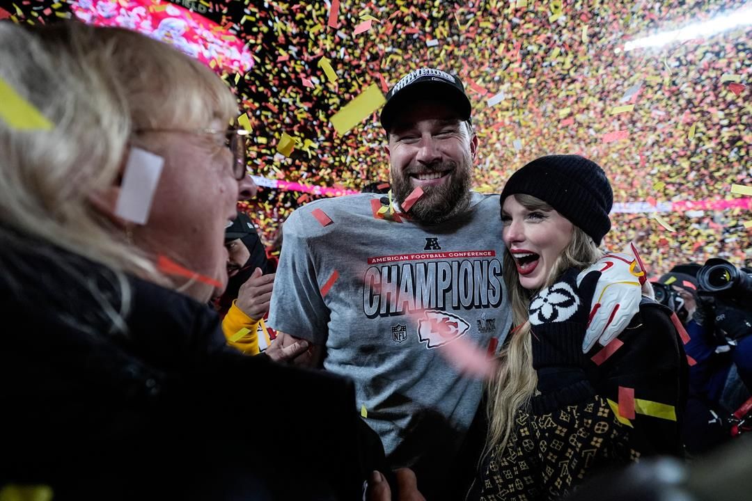 FILE - Donna Kelce stands with her son Kansas City Chiefs tight end Travis Kelce and Taylor Swift after the AFC Championship NFL football game against the Buffalo Bills, Jan. 26, 2025, in Kansas City, Mo. (AP Photo/Ashley Landis, File)